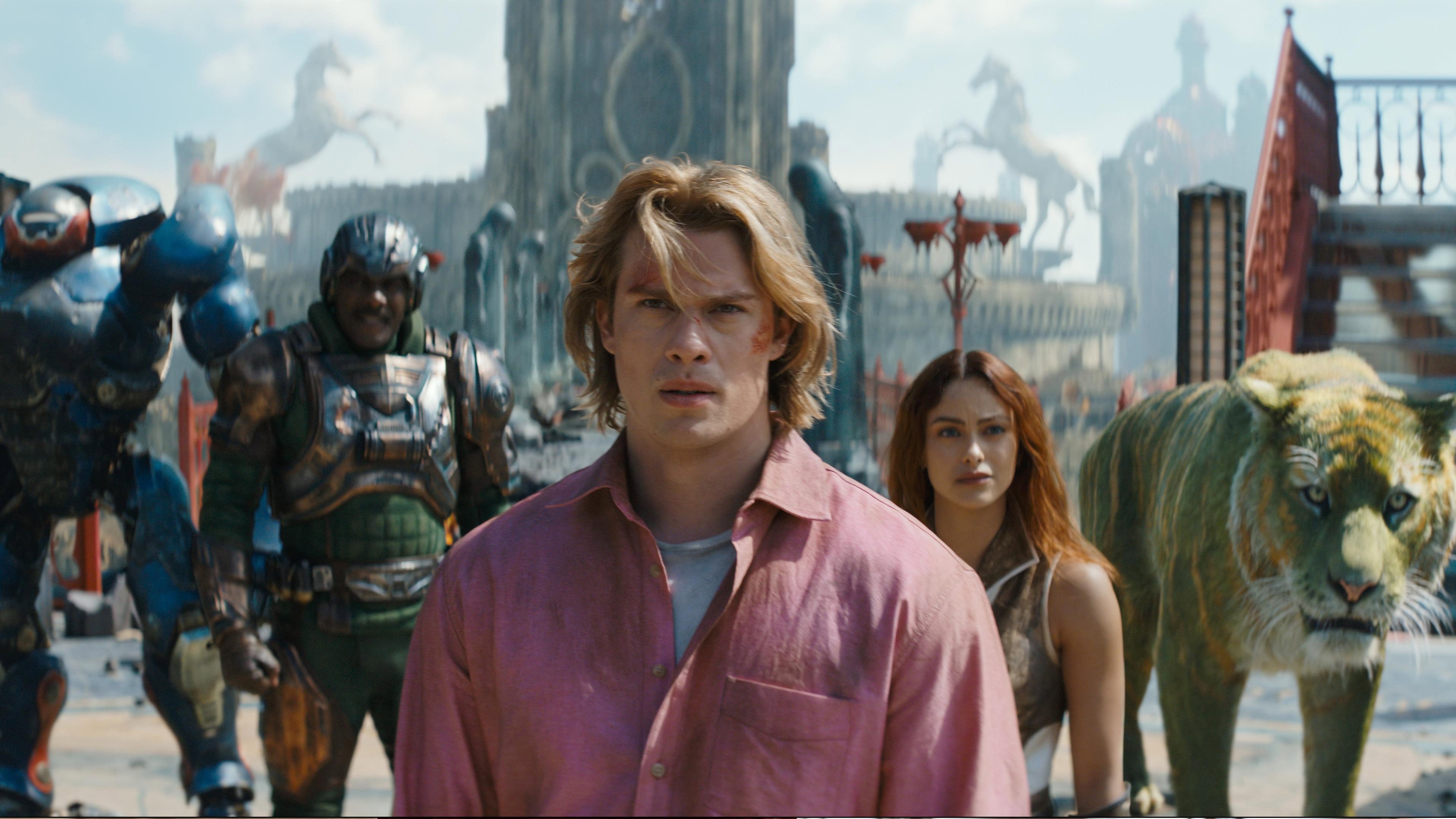 Masters of the Universe set visit: Nicholas Galitzine as Prince Adam, Idris Elba as Duncan, and Camila Mendes as Teela on Eternia.